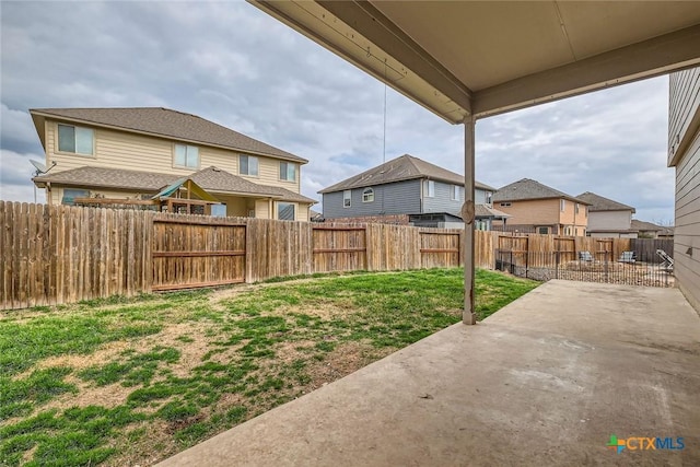 view of yard with a patio area and a fenced backyard