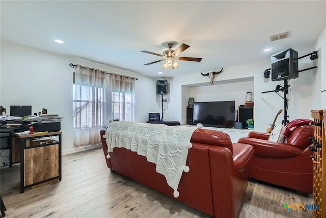 living area featuring ceiling fan, light wood-style flooring, visible vents, and recessed lighting