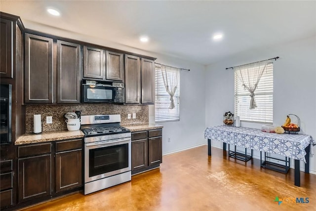 kitchen with stainless steel range with gas cooktop, decorative backsplash, finished concrete floors, dark brown cabinetry, and black microwave