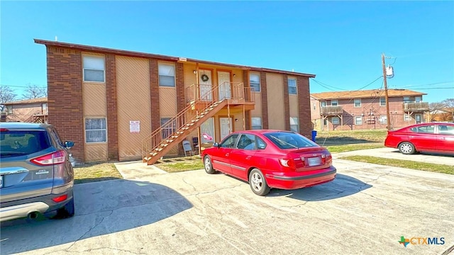 view of property featuring stairway