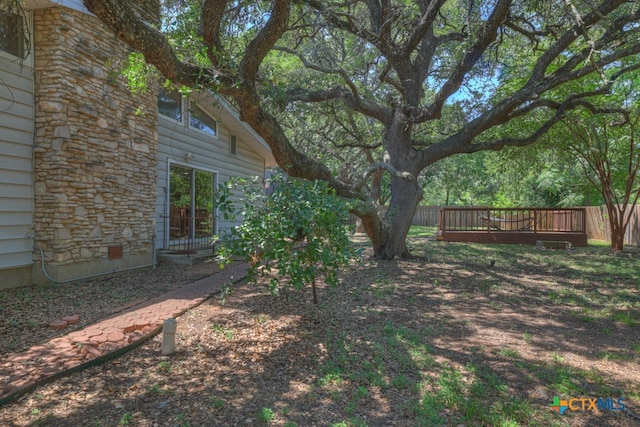 view of yard with a wooden deck