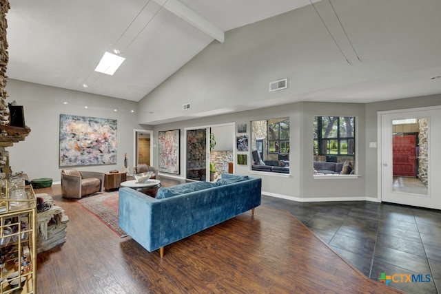 living room with beamed ceiling, high vaulted ceiling, a skylight, and dark hardwood / wood-style flooring