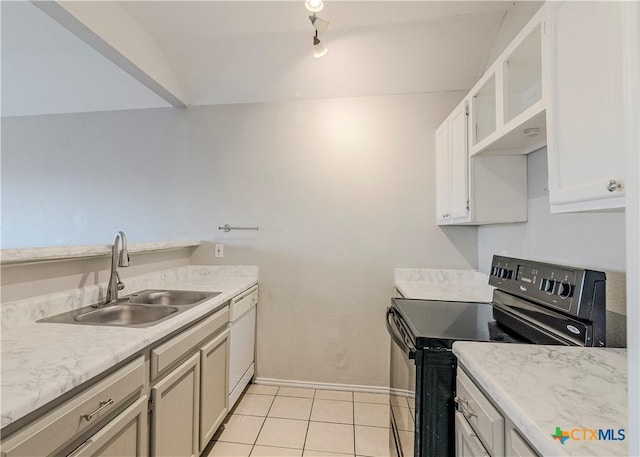 kitchen featuring light tile patterned floors, white dishwasher, black electric range, and sink