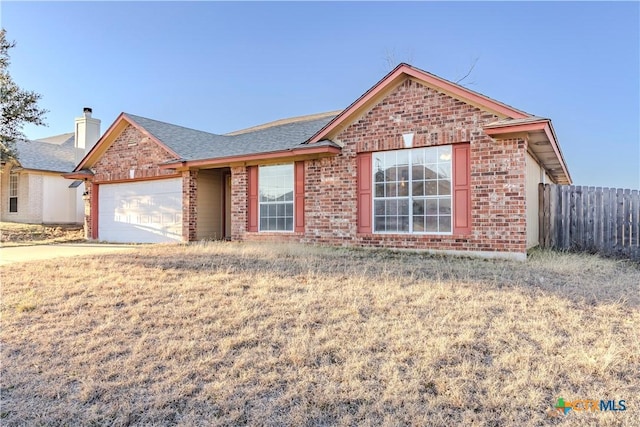 ranch-style house featuring a garage