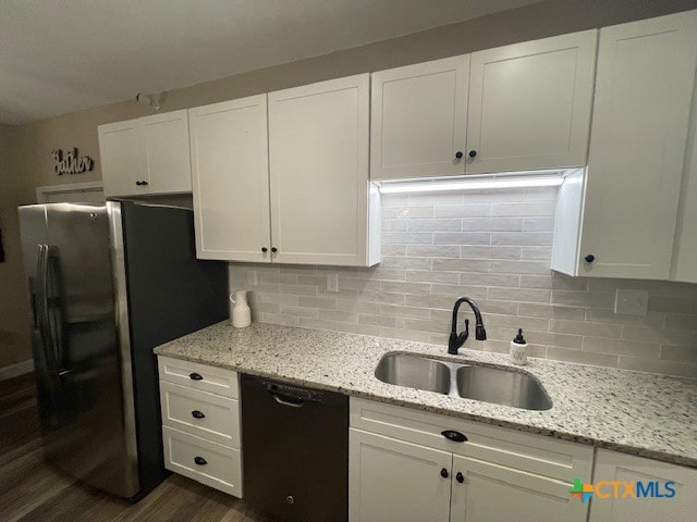 kitchen with stainless steel refrigerator, sink, white cabinets, dark wood-type flooring, and dishwasher