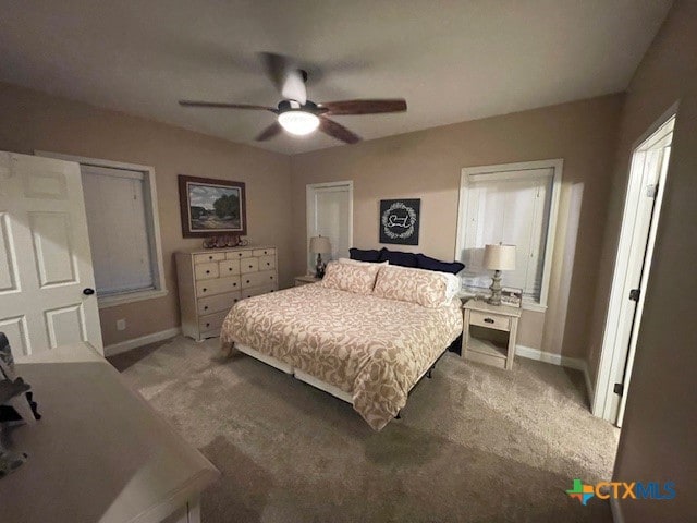 carpeted bedroom with ceiling fan