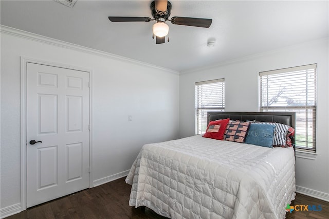 bedroom featuring ornamental molding, dark hardwood / wood-style flooring, and ceiling fan