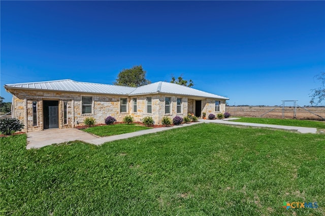 ranch-style house with a front lawn