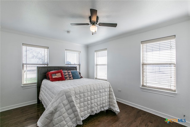 bedroom with crown molding, dark hardwood / wood-style flooring, multiple windows, and ceiling fan