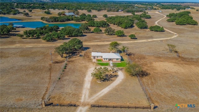 birds eye view of property featuring a rural view and a water view