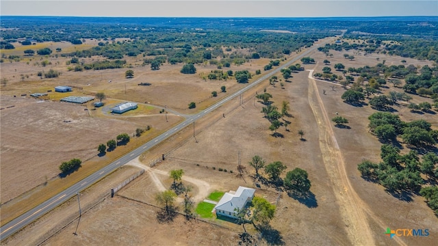 birds eye view of property featuring a rural view