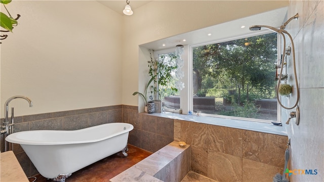 bathroom with tiled bath