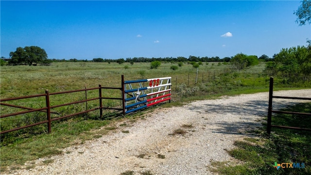 view of gate featuring a rural view