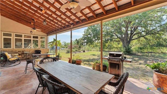 view of patio with ceiling fan and area for grilling