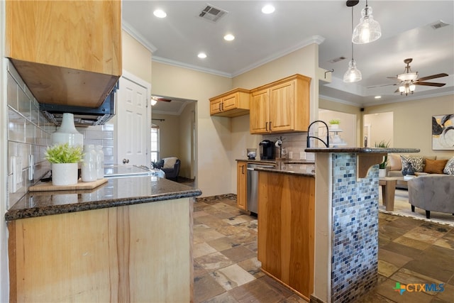 kitchen with light brown cabinets, hanging light fixtures, stainless steel dishwasher, decorative backsplash, and kitchen peninsula