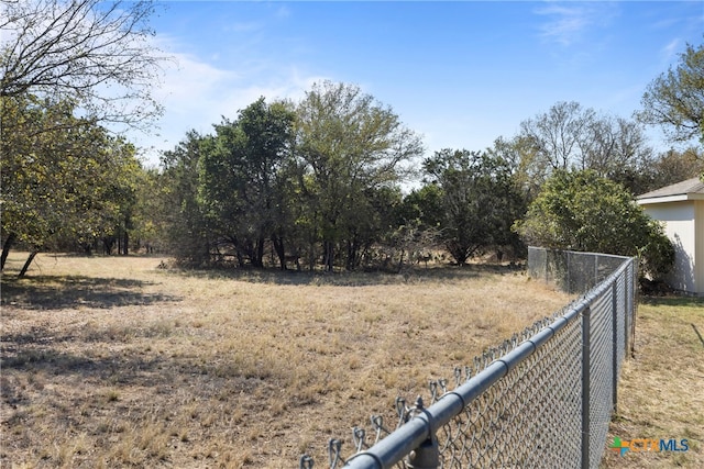 view of yard with a rural view