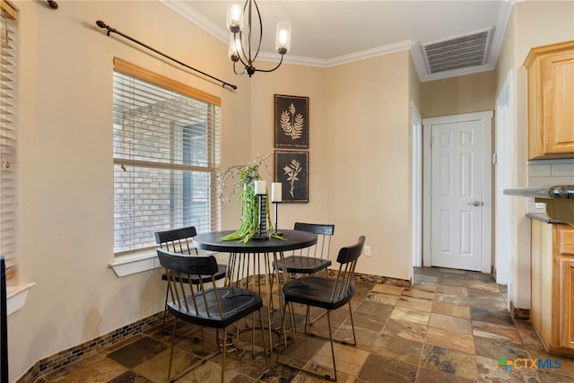 dining area with a chandelier and ornamental molding