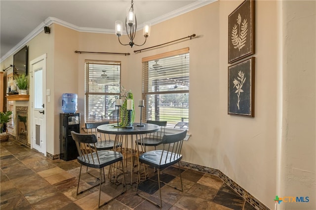 dining space with crown molding and a chandelier