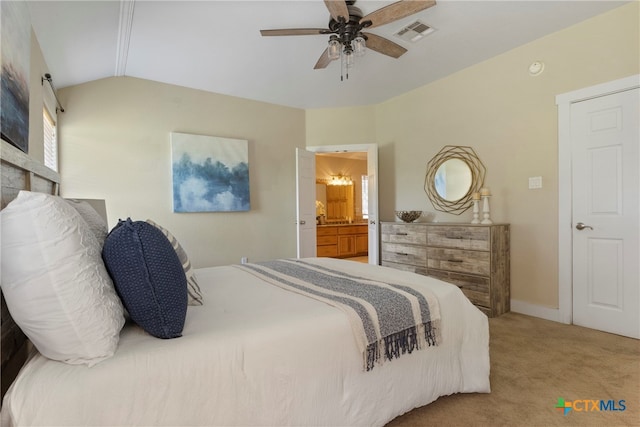 carpeted bedroom with connected bathroom, ceiling fan, and lofted ceiling