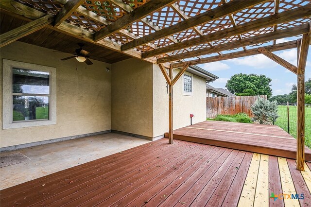 wooden terrace featuring a patio, a pergola, and ceiling fan