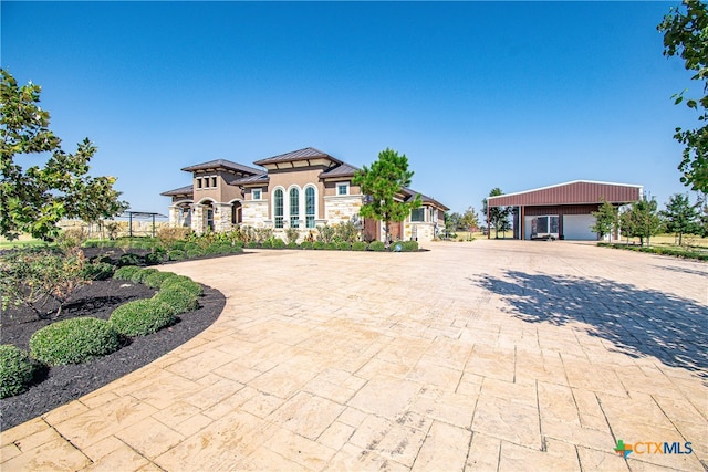 view of front of house featuring an outbuilding and a garage