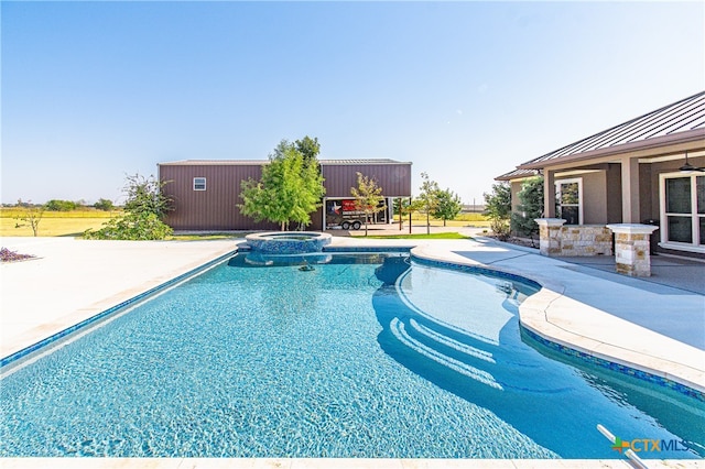 view of pool featuring an in ground hot tub and a patio area