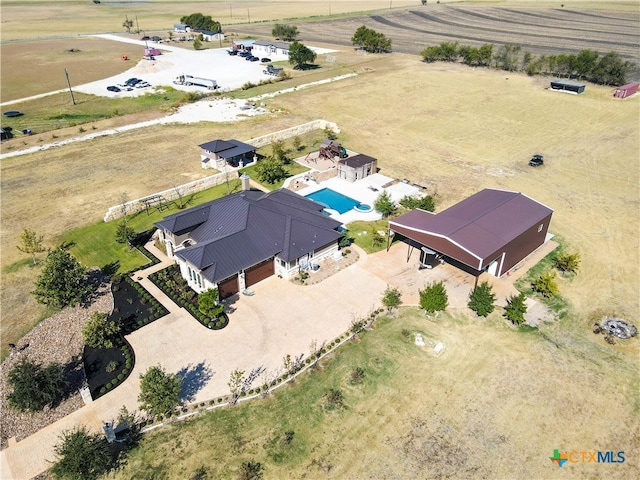 birds eye view of property featuring a rural view