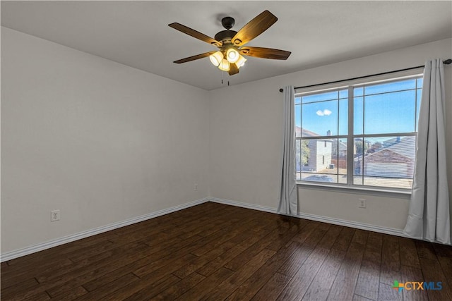 unfurnished room with ceiling fan, baseboards, and hardwood / wood-style flooring