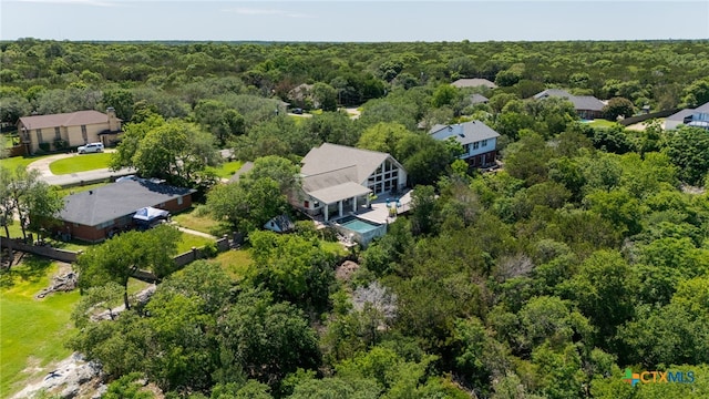 drone / aerial view of a heavily wooded area