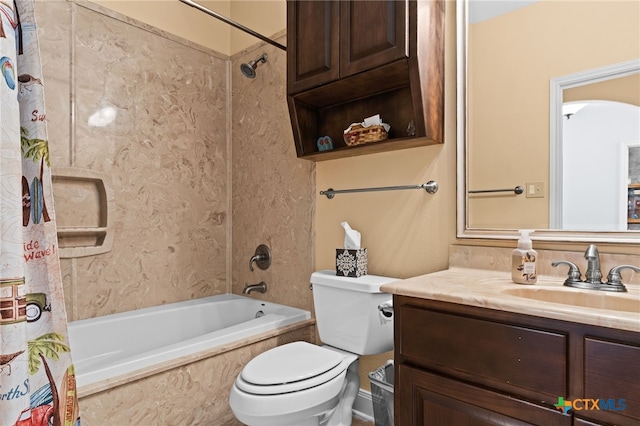 bathroom with toilet, shower / tub combo, and vanity