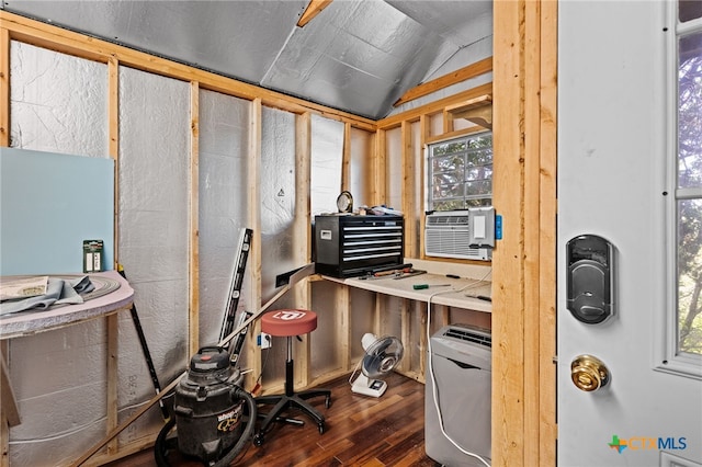 miscellaneous room with dark wood-type flooring, lofted ceiling, healthy amount of natural light, and cooling unit