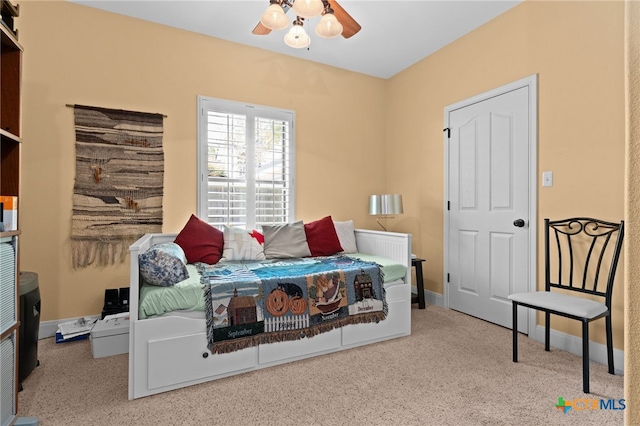 bedroom featuring baseboards, carpet, and ceiling fan