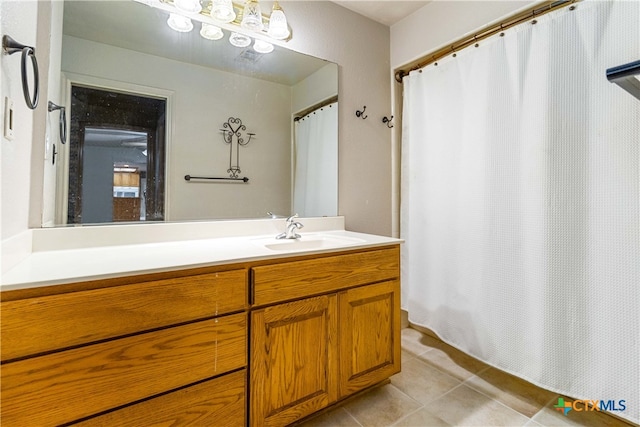 bathroom with tile patterned flooring and vanity