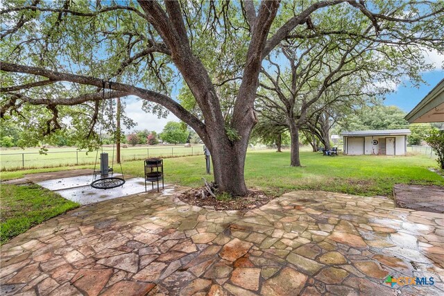 view of patio featuring an outdoor fire pit