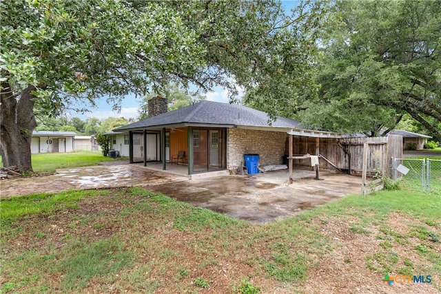 back of property featuring central AC unit, a patio, and a yard