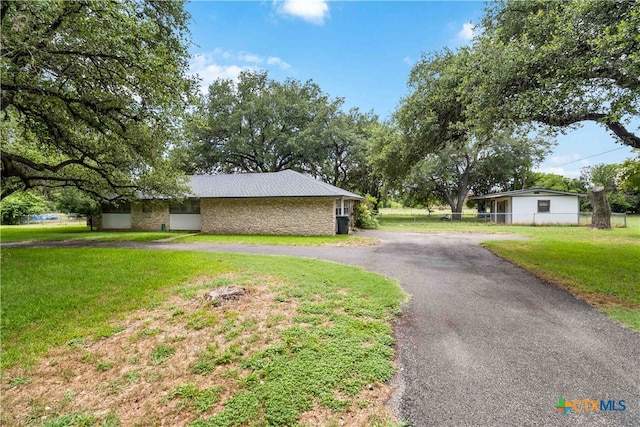 view of home's exterior with a yard