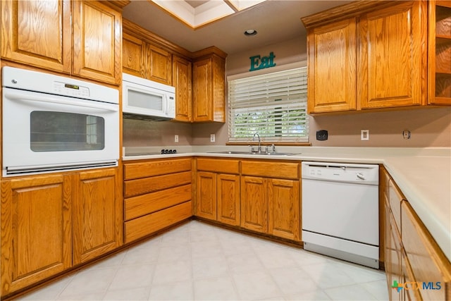 kitchen featuring sink and white appliances