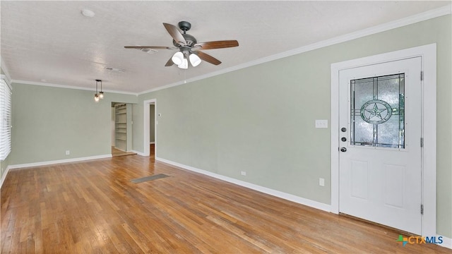 1261 W Mill St, New Braunfels, TX 78130 - entryway with light wood finished floors, ceiling fan, and crown molding