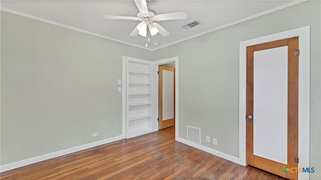 1261 W Mill St, New Braunfels, TX 78130 - unfurnished bedroom featuring wood finished floors, ornamental molding, and a ceiling fan