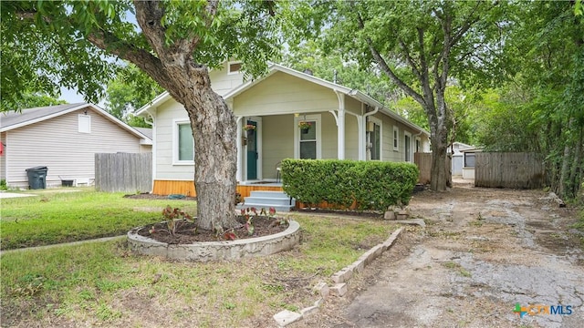 1261 W Mill St, New Braunfels, TX 78130 - bungalow with covered porch and asphalt driveway