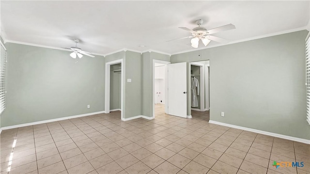 1261 W Mill St, New Braunfels, TX 78130 - unfurnished bedroom featuring light tile patterned floors, crown molding, and a ceiling fan