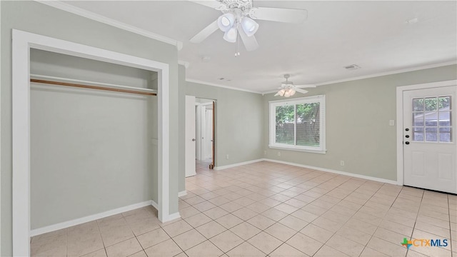 1261 W Mill St, New Braunfels, TX 78130 - unfurnished bedroom with light tile patterned floors, crown molding, a closet, and ceiling fan