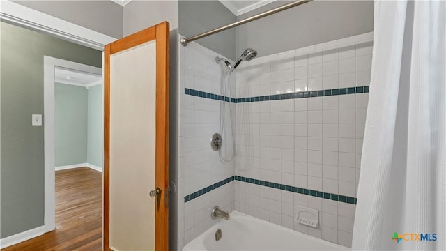 1261 W Mill St, New Braunfels, TX 78130 - bathroom with shower / bathtub combination with curtain, ornamental molding, and wood finished floors