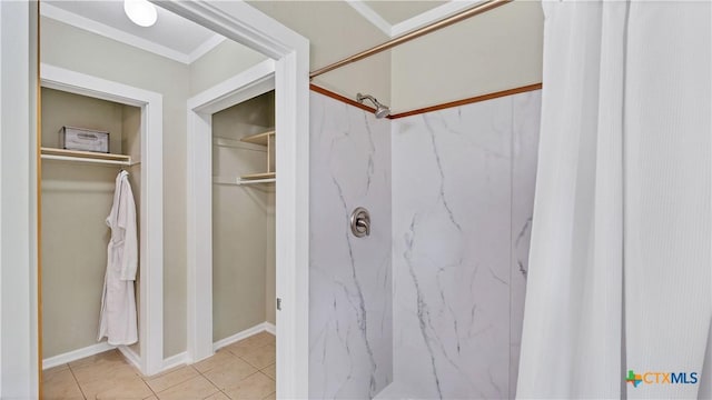 1261 W Mill St, New Braunfels, TX 78130 - bathroom with a marble finish shower, a walk in closet, ornamental molding, and tile patterned floors