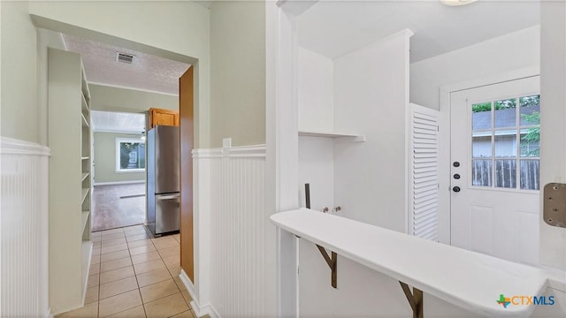 1261 W Mill St, New Braunfels, TX 78130 - corridor with light tile patterned flooring and wainscoting