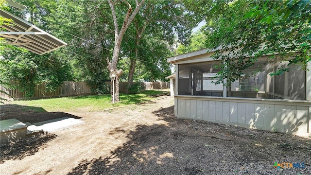 1261 W Mill St, New Braunfels, TX 78130 - fenced backyard featuring a sunroom