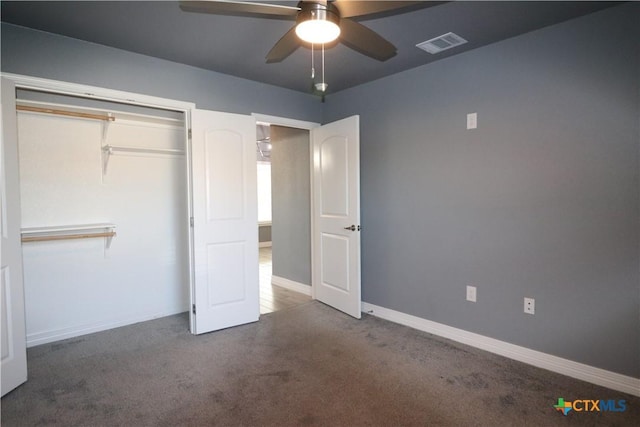 unfurnished bedroom with carpet, a closet, visible vents, a ceiling fan, and baseboards