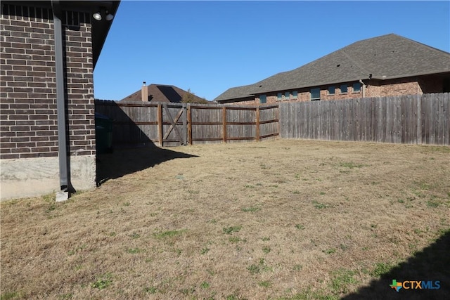 view of yard featuring a fenced backyard