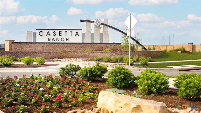 community sign with fence
