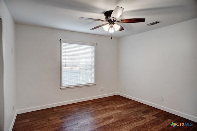 416 S Welhausen Ave, Shiner, TX 77984 - spare room featuring a ceiling fan, wood finished floors, and baseboards